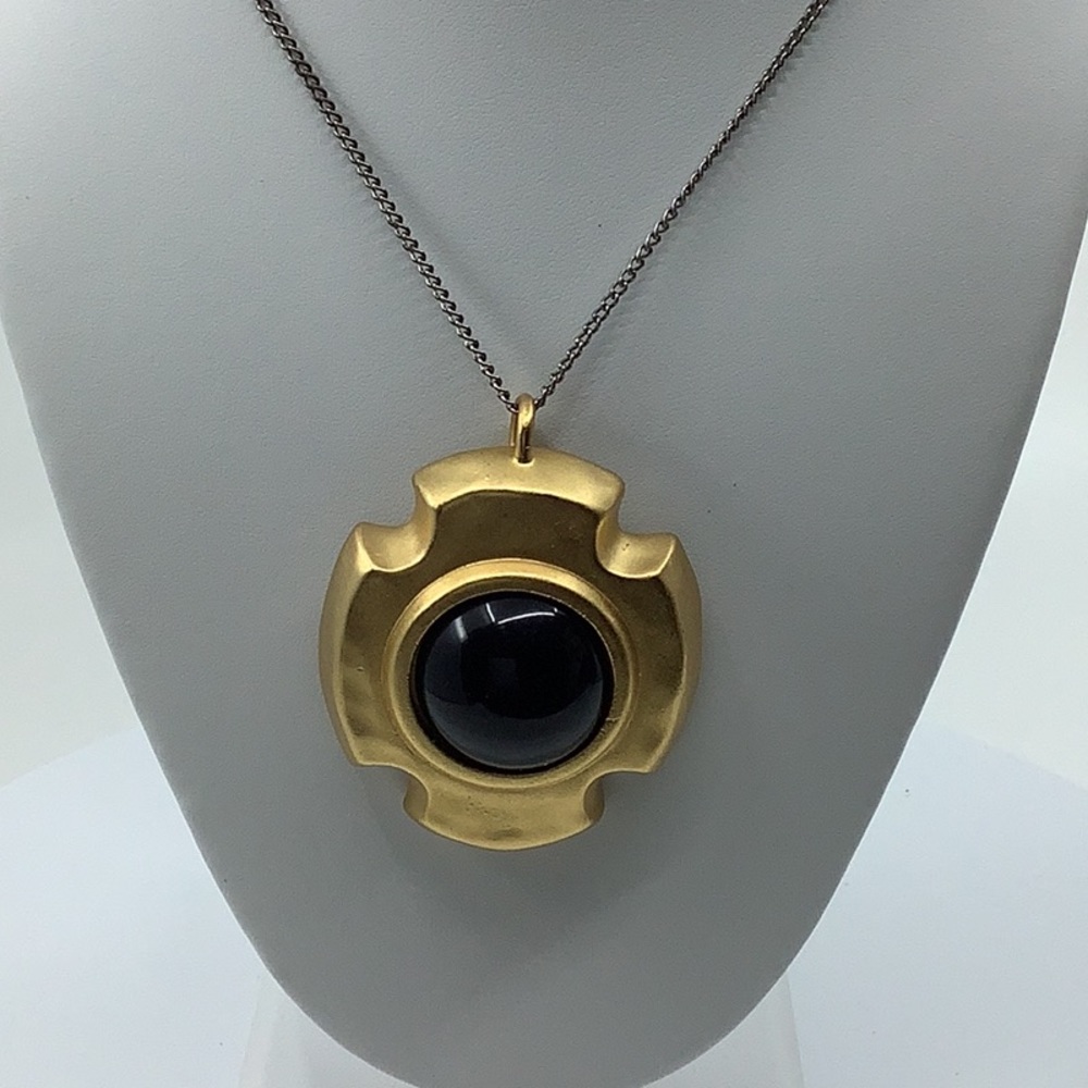 Vintage Linda Davis signed pendant -brushed gold tone with black lucite center.